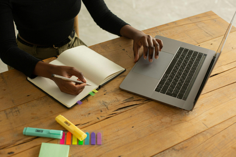 Storytelling strategist writing in journal.